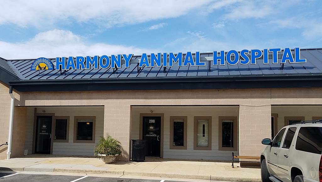 Front of hospital with sign saying Harmony Animal Hospital