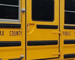 Side of school bus with "Fairfax County Public Schools" in letters