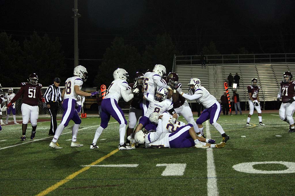 Lake Braddock defenders all around Mount Vernon ball carrrier