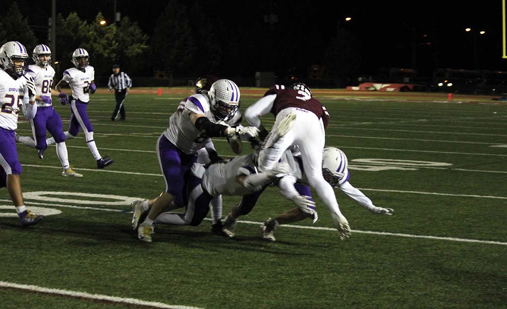 Webb with three defenders hitting him