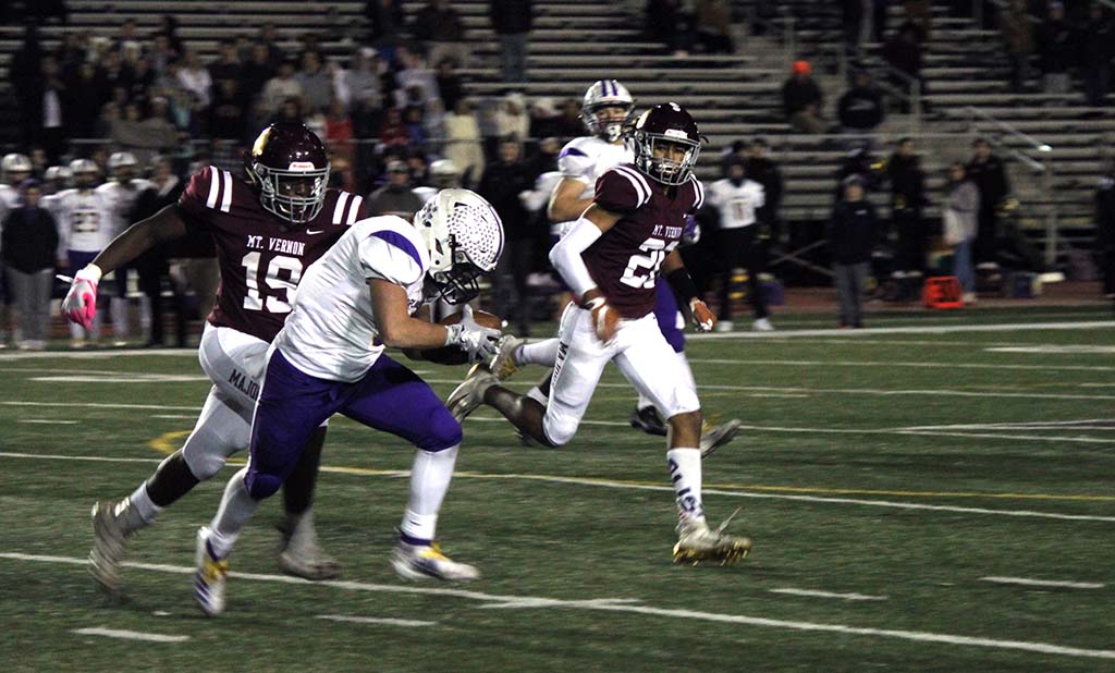 Lake Braddock running back trying to run around tackler but beginning to trip