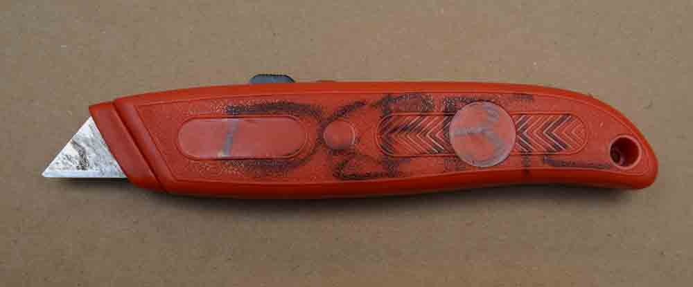 Box cutter with writing on it