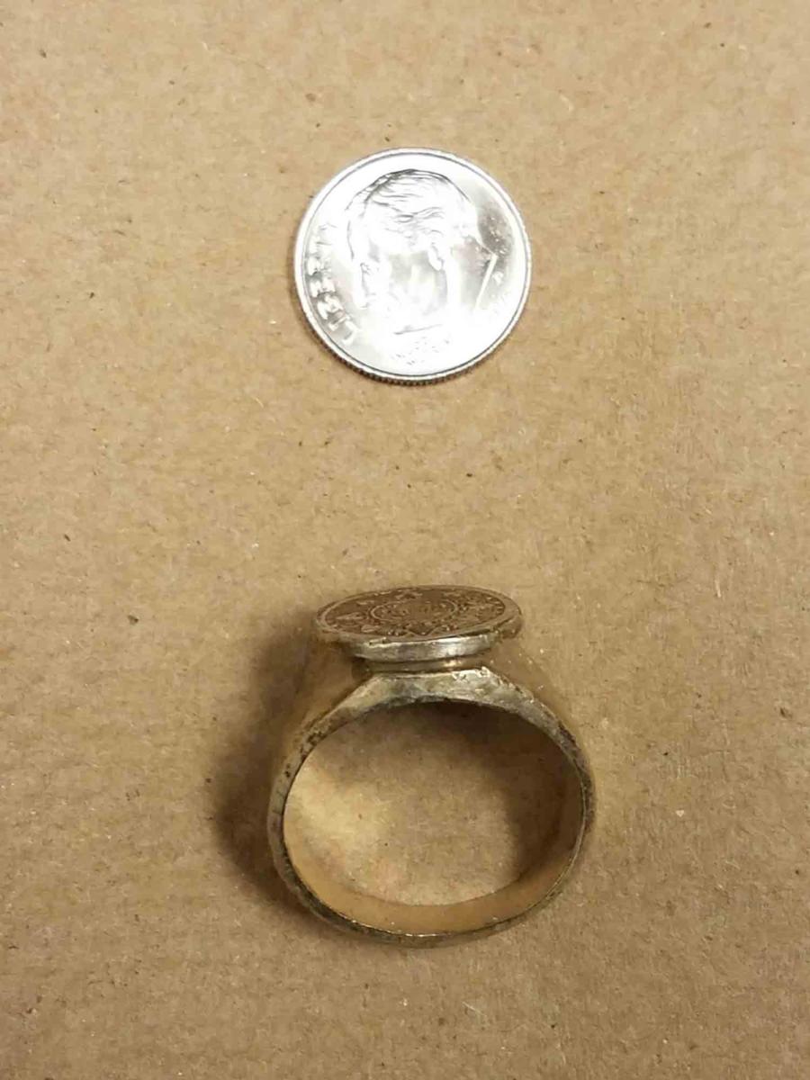 Another image of ring compared to dime