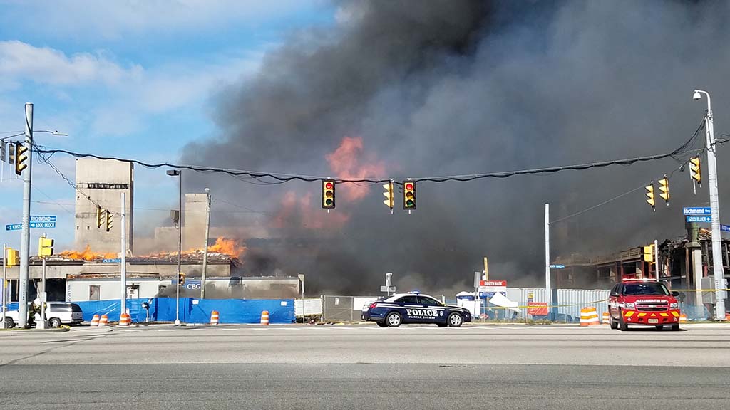 Flames burning but mostly black smoke