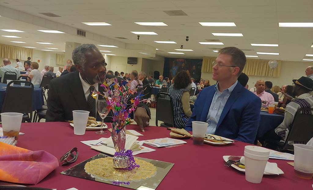 Two people talking at table