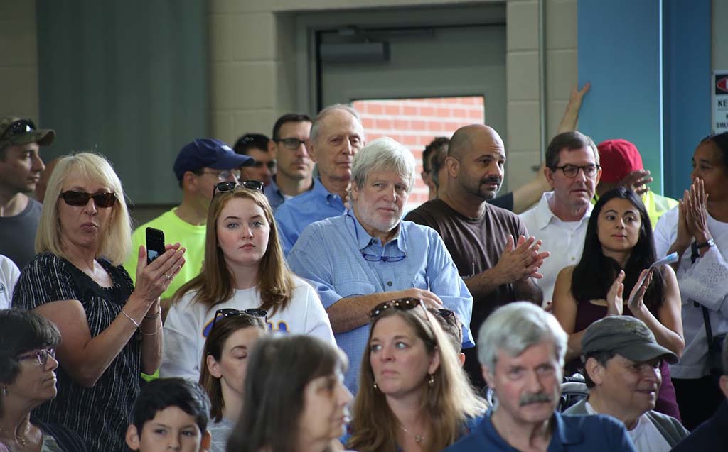 Crowd of people watching speakers