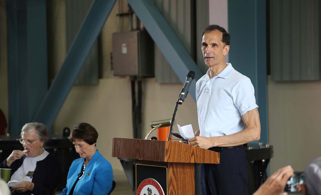 Dan Storck speaking at podium